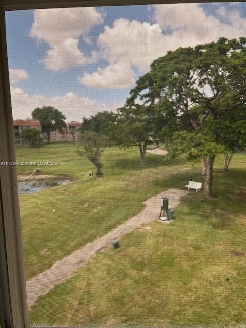 9841 Sunrise Lakes Blvd Unit 310, Sunrise, FL 33322 - view of property's community featuring a lawn