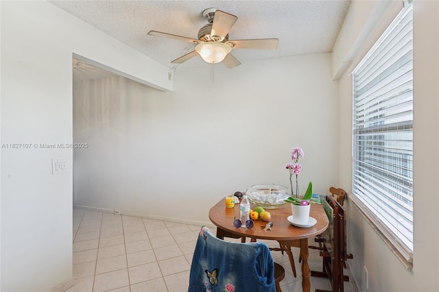 13450 SW 3rd St Unit 408D, Pembroke Pines, FL 33027 - dining room with a ceiling fan, a textured ceiling, and light tile patterned floors