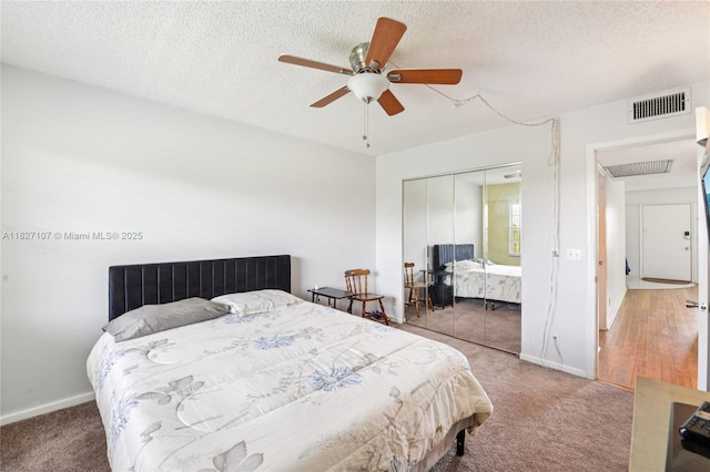 13450 SW 3rd St Unit 408D, Pembroke Pines, FL 33027 - carpeted bedroom with a closet, a textured ceiling, and a ceiling fan