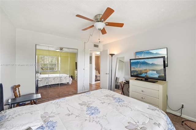 13450 SW 3rd St Unit 408D, Pembroke Pines, FL 33027 - bedroom with a ceiling fan, a textured ceiling, and a closet