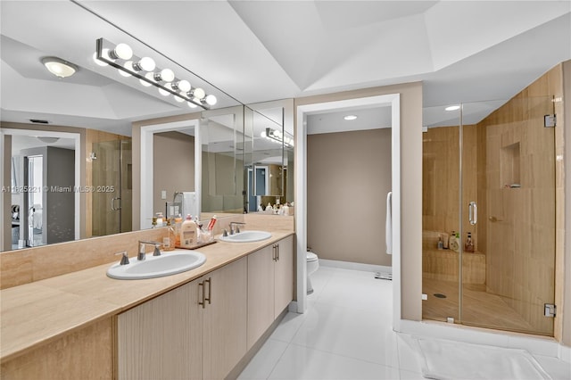 7000 Island Blvd Unit 1408, Aventura, FL 33160 - bathroom featuring double vanity, tile patterned flooring, a shower stall, and recessed lighting