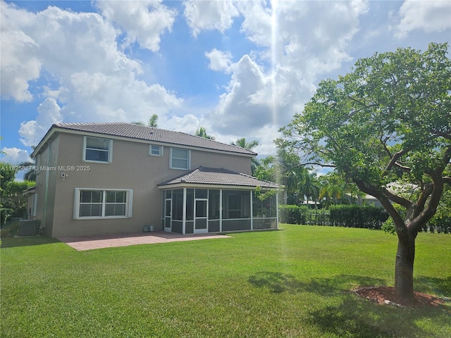 21300 Waycross Dr, Boca Raton, FL 33428 - back of property featuring a sunroom, stucco siding, a lawn, a patio area, and a tile roof