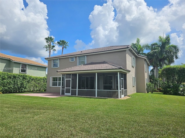 21300 Waycross Dr, Boca Raton, FL 33428 - rear view of house featuring a sunroom, stucco siding, a yard, and a tile roof