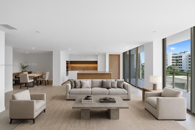 1135 103rd St Unit 408, Bay Harbor Islands, FL 33154 - living room with floor to ceiling windows and recessed lighting