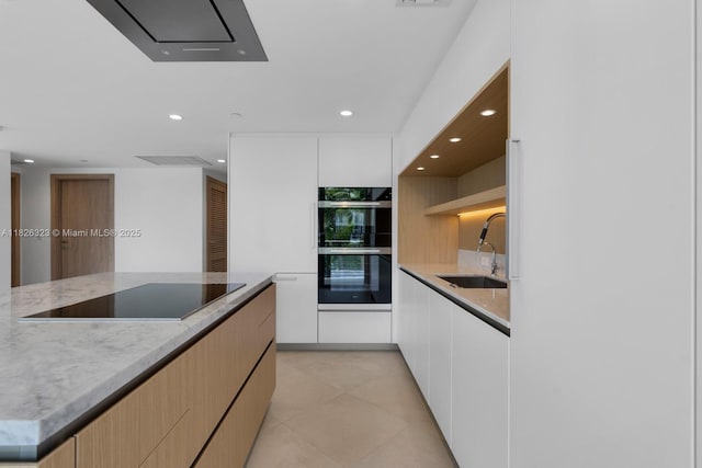 1135 103rd St Unit 408, Bay Harbor Islands, FL 33154 - kitchen with black electric cooktop, modern cabinets, double oven, recessed lighting, and light stone counters