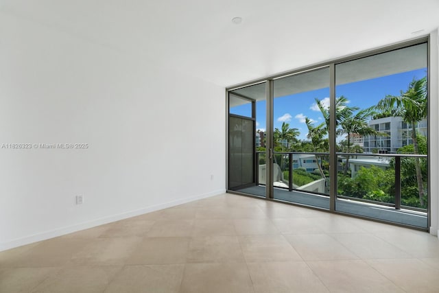 1135 103rd St Unit 408, Bay Harbor Islands, FL 33154 - unfurnished room featuring floor to ceiling windows and baseboards