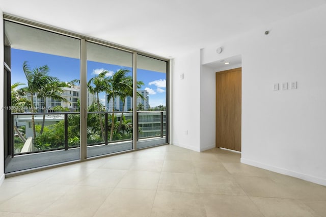 1135 103rd St Unit 408, Bay Harbor Islands, FL 33154 - empty room featuring floor to ceiling windows and a smoke detector