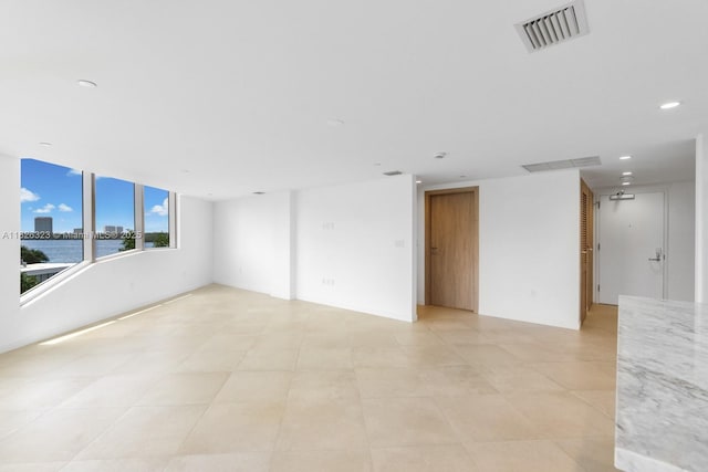 1135 103rd St Unit 408, Bay Harbor Islands, FL 33154 - unfurnished room featuring recessed lighting, a water view, and light tile patterned floors
