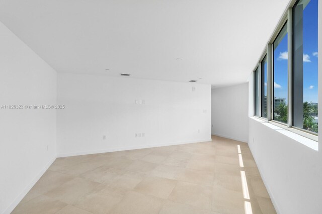 1135 103rd St Unit 408, Bay Harbor Islands, FL 33154 - empty room with baseboards
