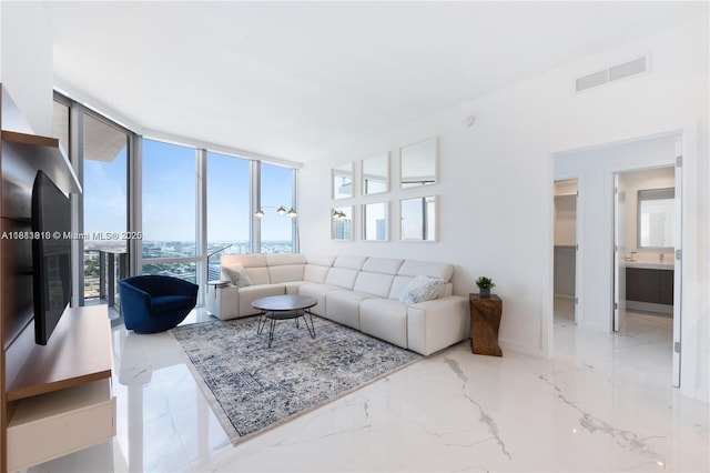 851 NE 1st Ave Unit 3308, Miami, FL 33132 - living area with marble tiled flooring and baseboards