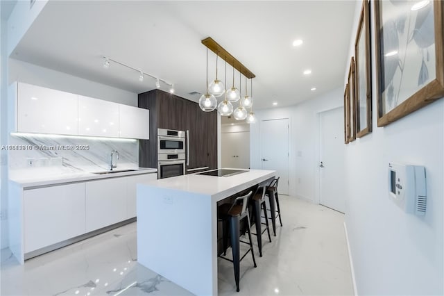 851 NE 1st Ave Unit 3308, Miami, FL 33132 - kitchen with modern cabinets, white cabinetry, double oven, pendant lighting, and recessed lighting