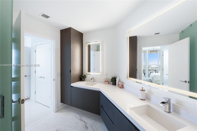 851 NE 1st Ave Unit 3308, Miami, FL 33132 - full bathroom with double vanity, ensuite bathroom, and marble look tile flooring