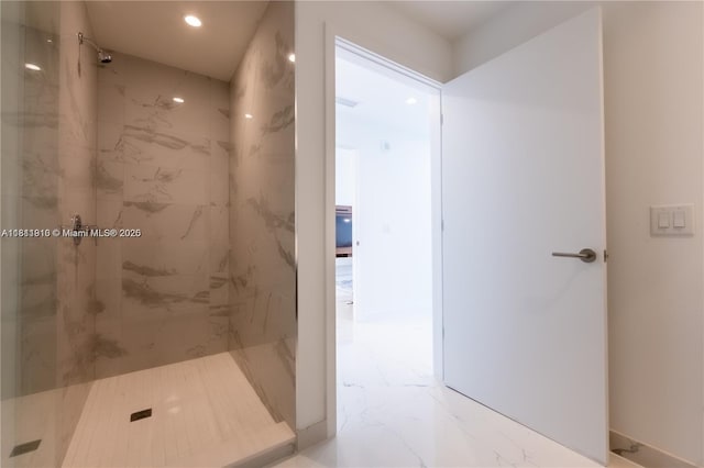 851 NE 1st Ave Unit 3308, Miami, FL 33132 - bathroom featuring marble look tile flooring, a marble finish shower, and recessed lighting