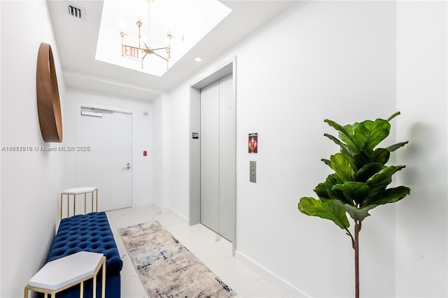 851 NE 1st Ave Unit 3308, Miami, FL 33132 - corridor featuring elevator, a chandelier, light marble finish floors, and recessed lighting