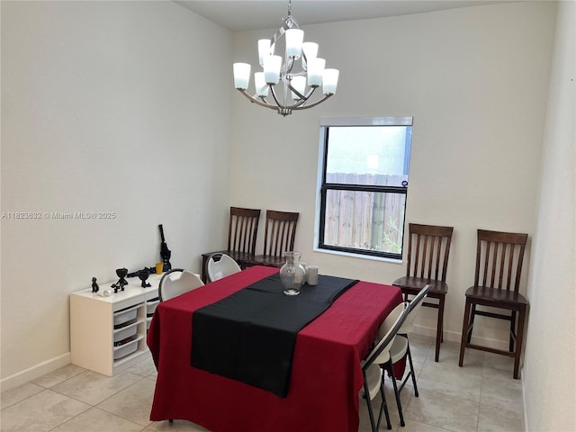 134 NE 23rd Ter, Homestead, FL 33033 - dining area featuring a chandelier and light tile patterned floors