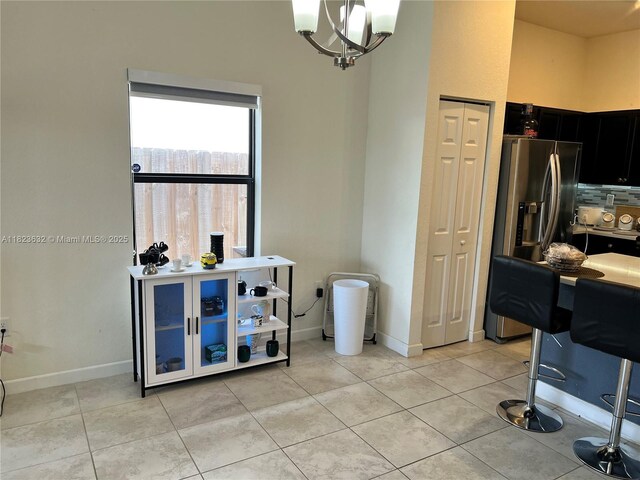 134 NE 23rd Ter, Homestead, FL 33033 - dining room featuring light tile patterned floors and a chandelier
