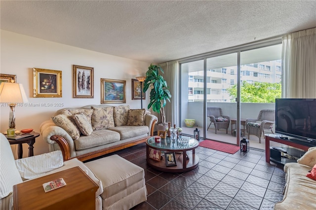 5 Island Ave Unit 6A, Miami Beach, FL 33139 - living room featuring a textured ceiling, tile patterned flooring, and a wall of windows
