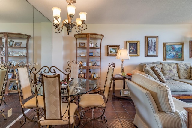 5 Island Ave Unit 6A, Miami Beach, FL 33139 - dining room featuring dark tile patterned flooring and a chandelier