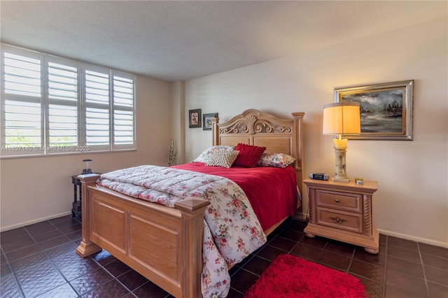 5 Island Ave Unit 6A, Miami Beach, FL 33139 - bedroom with dark tile patterned floors and a textured ceiling