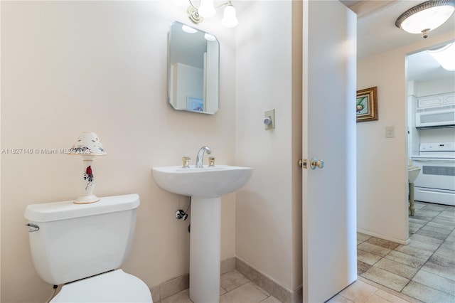 5 Island Ave Unit 6A, Miami Beach, FL 33139 - bathroom featuring toilet and tile patterned floors