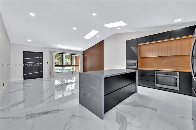 5890 SW 13th St, Plantation, FL 33317 - walk in closet featuring lofted ceiling, light marble finish floors, and a skylight