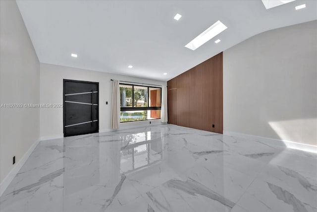 5890 SW 13th St, Plantation, FL 33317 - unfurnished room featuring lofted ceiling, marble finish flooring, recessed lighting, and a skylight