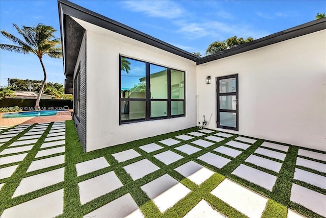 5890 SW 13th St, Plantation, FL 33317 - view of patio featuring an outdoor pool