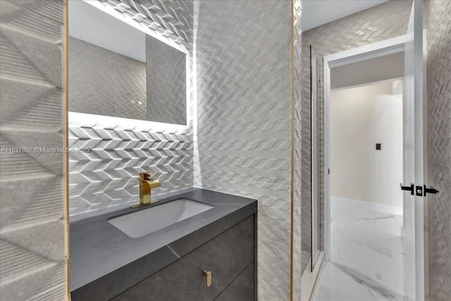 5890 SW 13th St, Plantation, FL 33317 - bathroom featuring vanity and marble look tile flooring