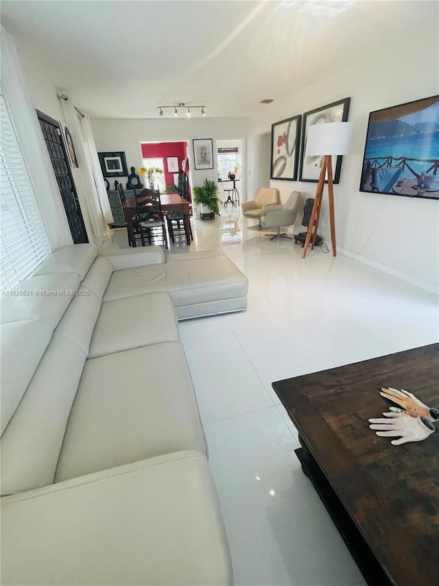 759 NE 87th St, Miami, FL 33138 - tiled living room with track lighting and baseboards