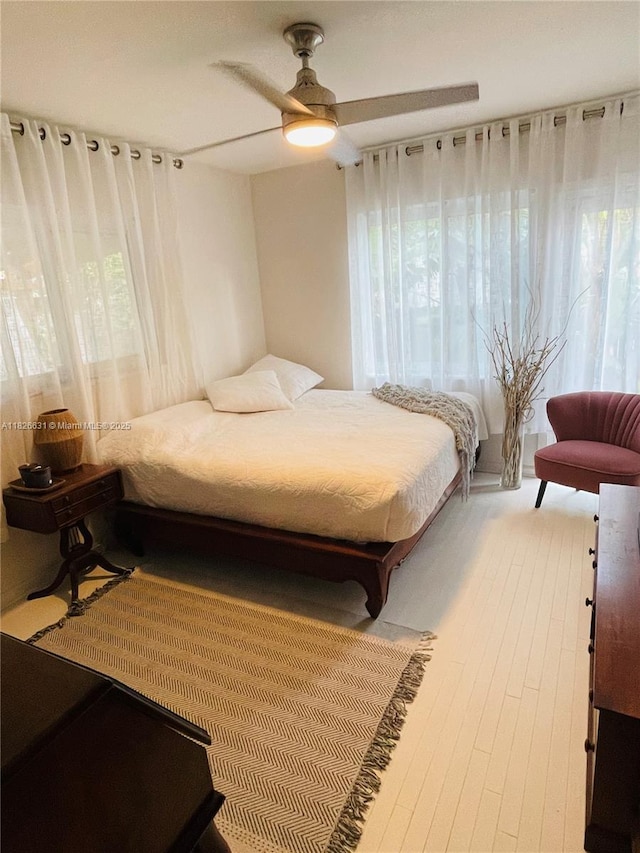 759 NE 87th St, Miami, FL 33138 - bedroom featuring multiple windows, a ceiling fan, and light wood-type flooring