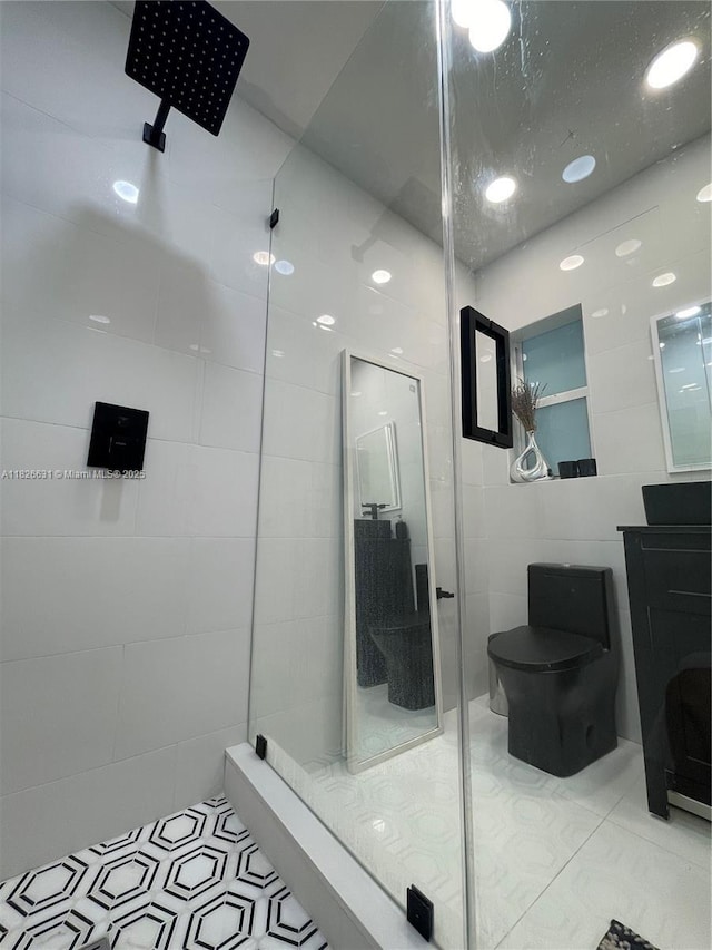 759 NE 87th St, Miami, FL 33138 - bathroom with a stall shower, tile walls, vanity, and tile patterned floors