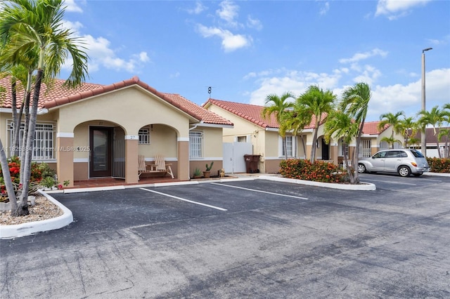 7101 W 24th Ave Unit 27, Hialeah, FL 33016 - view of property featuring uncovered parking