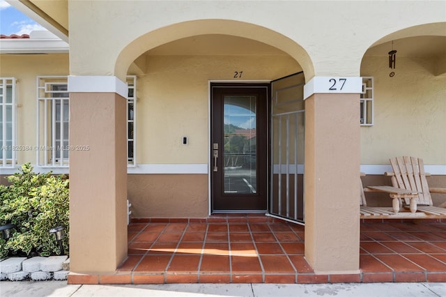 7101 W 24th Ave Unit 27, Hialeah, FL 33016 - doorway to property with stucco siding