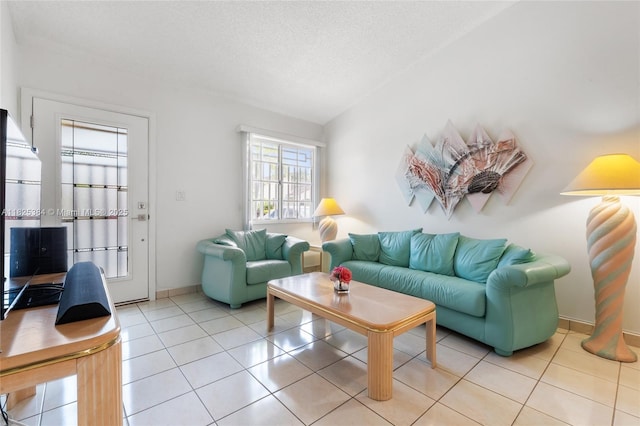 7101 W 24th Ave Unit 27, Hialeah, FL 33016 - living room featuring light tile patterned floors and a textured ceiling