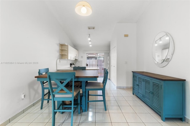 7101 W 24th Ave Unit 27, Hialeah, FL 33016 - dining space with light tile patterned floors and baseboards
