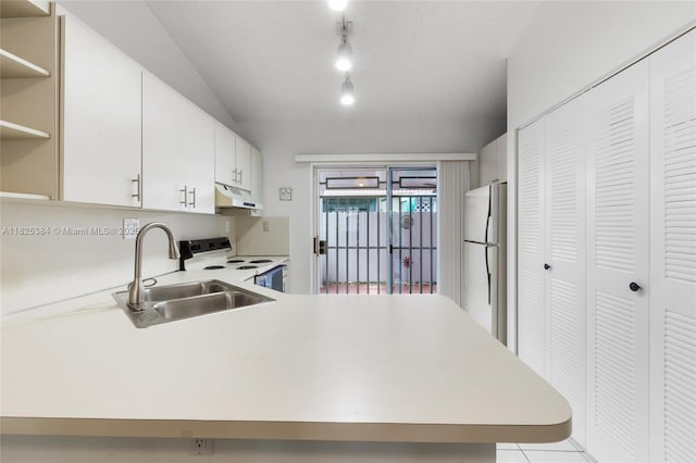7101 W 24th Ave Unit 27, Hialeah, FL 33016 - kitchen with white appliances, under cabinet range hood, light countertops, open shelves, and lofted ceiling