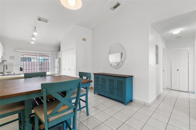 7101 W 24th Ave Unit 27, Hialeah, FL 33016 - dining space with light tile patterned flooring and track lighting