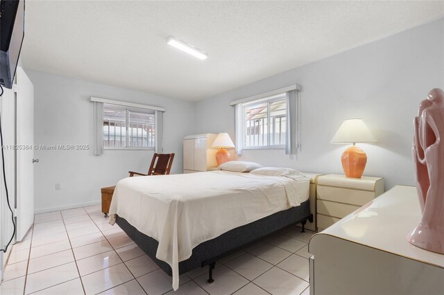 7101 W 24th Ave Unit 27, Hialeah, FL 33016 - bedroom with multiple windows and light tile patterned flooring