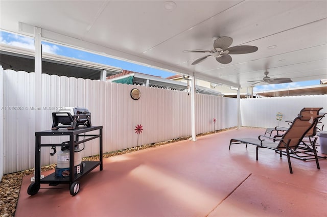 7101 W 24th Ave Unit 27, Hialeah, FL 33016 - fenced backyard with a patio area and ceiling fan