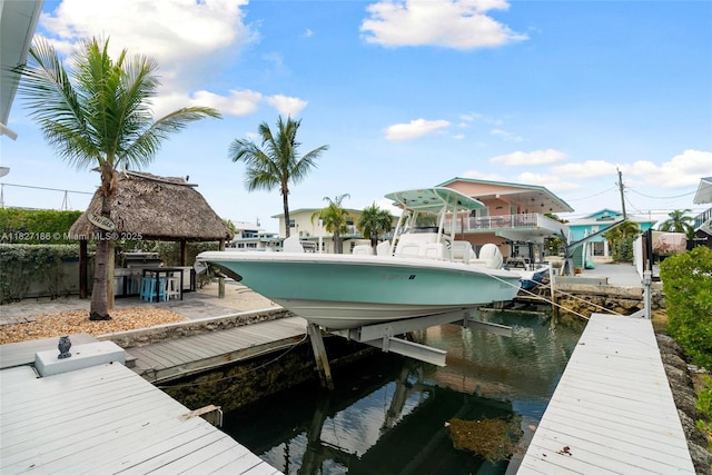 66 Seagate Blvd, Key Largo, FL 33037 - dock featuring boat lift and a water view