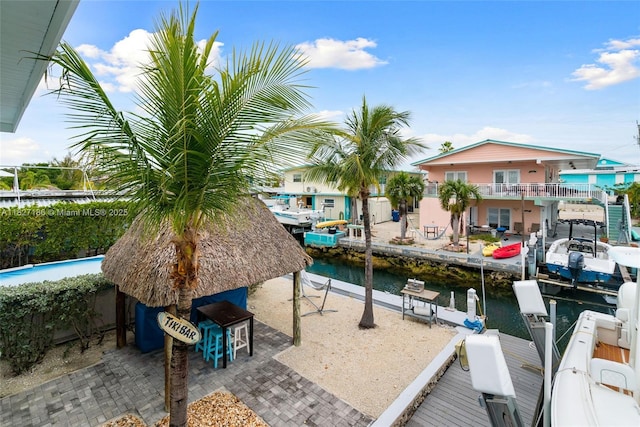 66 Seagate Blvd, Key Largo, FL 33037 - dock area featuring a water view and a patio