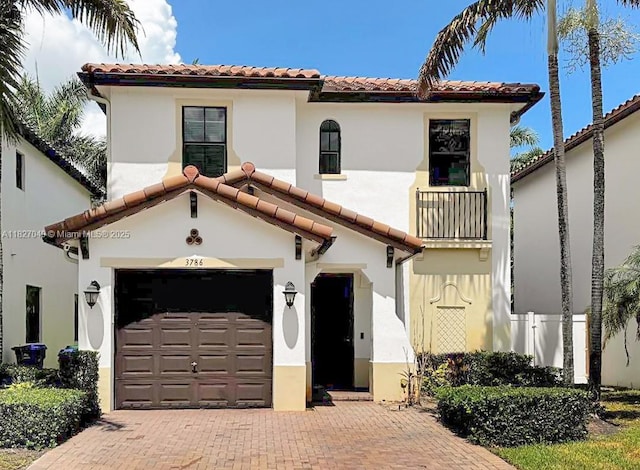 3786 SW 90th Ave, Miramar, FL 33025 - mediterranean / spanish home with a tiled roof, a balcony, a garage, and stucco siding