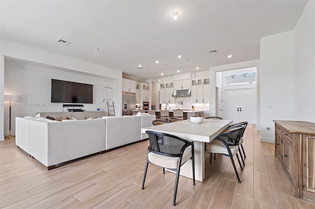 20161 SE Bridgewater Dr, Jupiter, FL 33458 - dining area featuring light wood finished floors and recessed lighting