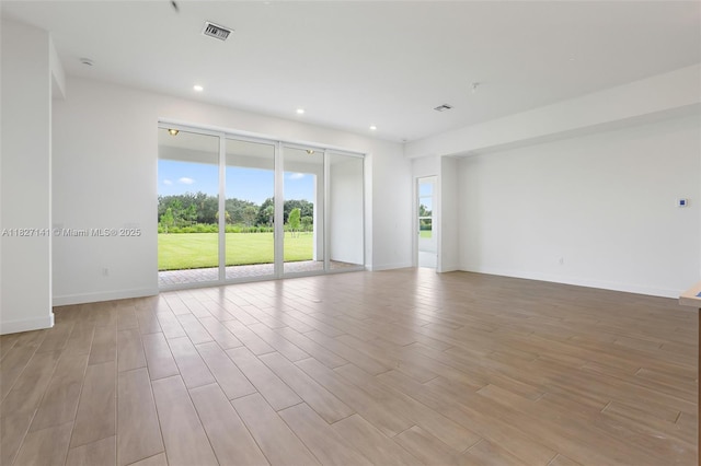 20161 SE Bridgewater Dr, Jupiter, FL 33458 - empty room with light wood-style flooring and recessed lighting