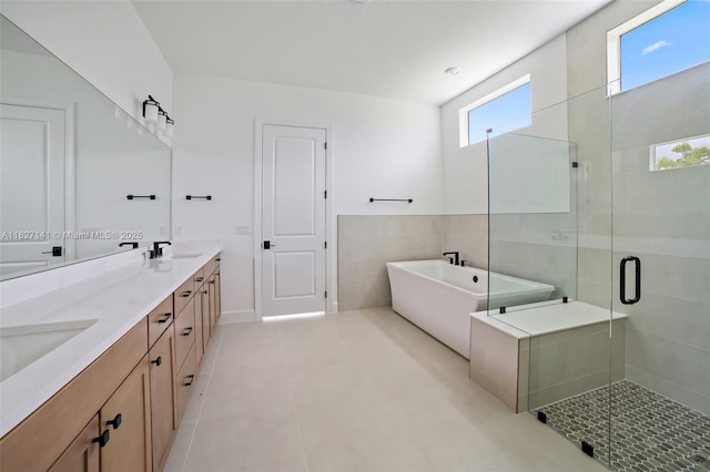 20161 SE Bridgewater Dr, Jupiter, FL 33458 - bathroom with double vanity, a stall shower, a soaking tub, and tile patterned flooring