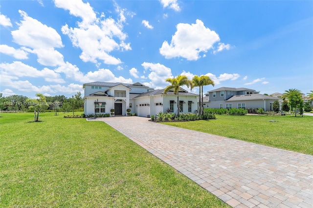 20161 SE Bridgewater Dr, Jupiter, FL 33458 - view of front of home with a garage, a front yard, driveway, and stucco siding