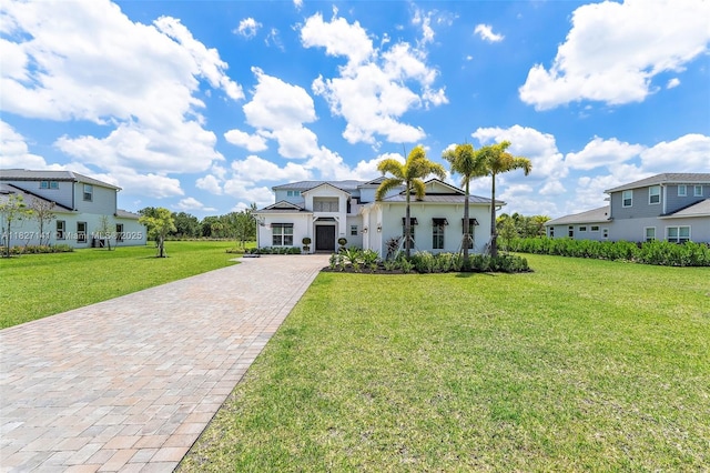 20161 SE Bridgewater Dr, Jupiter, FL 33458 - view of front of property featuring decorative driveway, a front yard, and a residential view