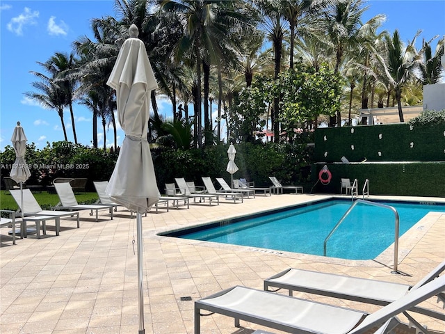 9455 Collins Ave Unit 301, Surfside, FL 33154 - community pool with a patio area