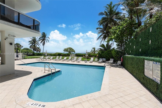 9455 Collins Ave Unit 301, Surfside, FL 33154 - community pool with a patio area