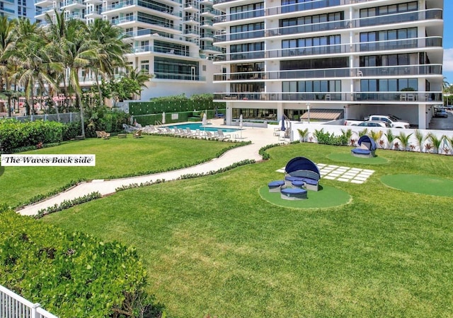9455 Collins Ave Unit 301, Surfside, FL 33154 - view of property's community with an area to practice putting and a swimming pool